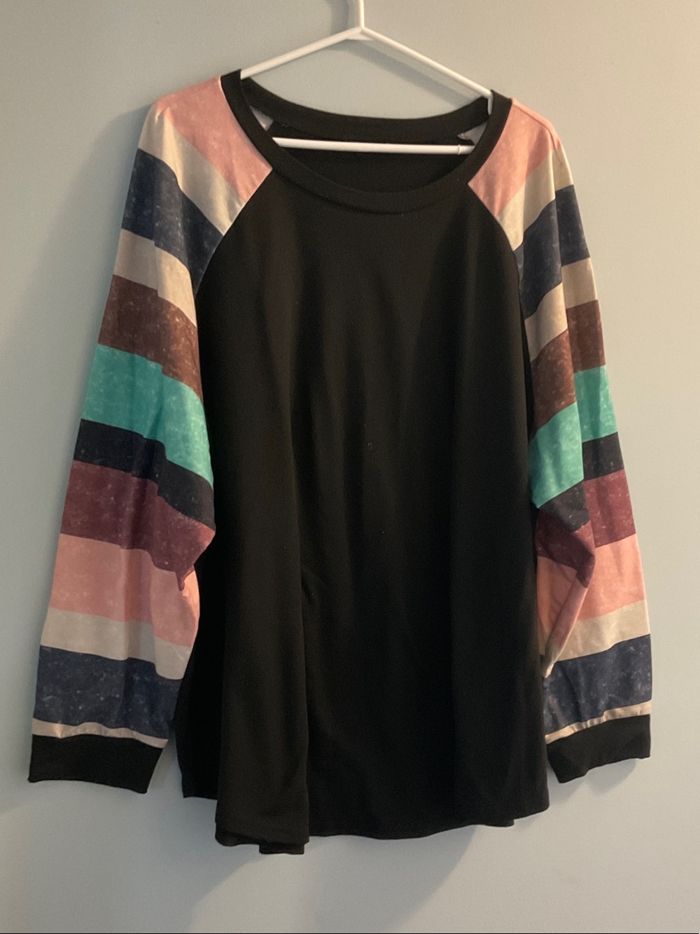 BloomChic Black Raglan Long Sleeve Top with Multicolor Stripe Sleeves